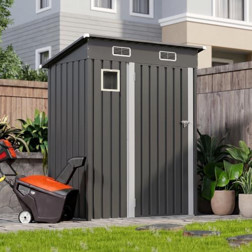 Small black lean to bike shed