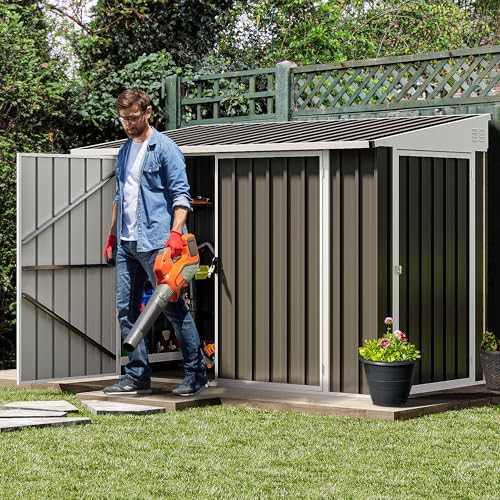 Dark gray three door metal storage shed — photo 3